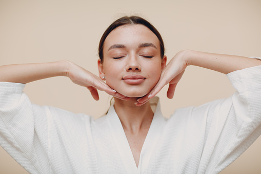 Woman getting a botox injection to reverse signs of aging.